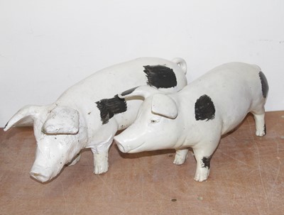 Lot 559 - A pair of fibre glass butcher's pigs, 56cm...