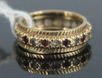 Lot 365 - A 9ct gold, garnet and white hardstone set...