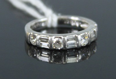 Lot 383 - A contemporary platinum and diamond half hoop...
