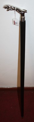 Lot 543 - A reproduction walking stick, the handle in...