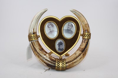 Lot 513 - A brass triple photograph frame, of heart...