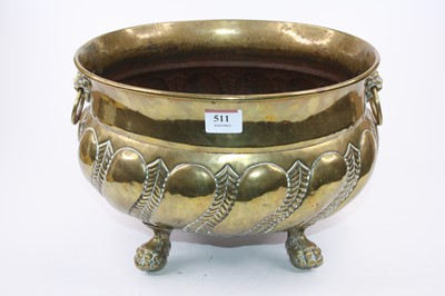 Lot 511 - A 19th century brass jardiniere, standing upon...