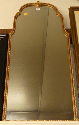 Lot 1015 - A gilt framed wall mirror, with shaped plate,...