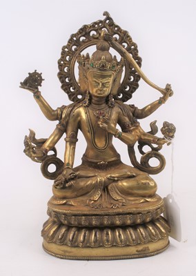 Lot 483 - An Asian gilt metal figure of a deity, h.24cm