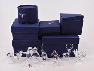 Lot 487 - A collection of Swarovski crystal models of...