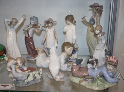 Lot 485 - A collection of Lladro and Nao porcelain...