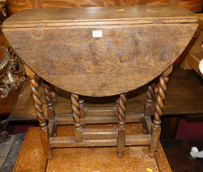 Lot 1332 - A joined oak dropflap gateleg occasional table,...