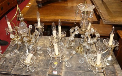Lot 1336 - A near-pair of moulded glass and brass...