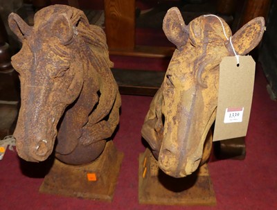 Lot 1339 - A pair of contemporary cast iron horse-head...