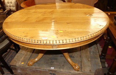 Lot 1341 - A light oak plank topped circular low pedestal...