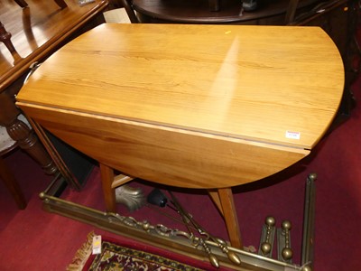 Lot 1348 - A contemporary Ercol pine dropflap kitchen...