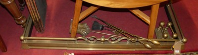 Lot 1349 - Brass fireside wares to include a curb fender,...