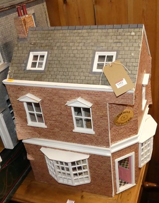 Lot 1352 - A three-storey corner dolls house, titled...