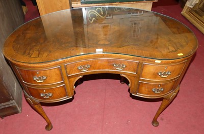 Lot 1356 - A 1930s figured walnut and crossbanded kidney...