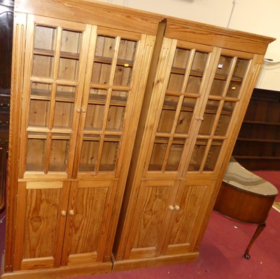 Lot 1358 - A pair of modern pine bookcases, having twin...