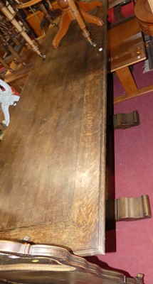 Lot 1367 - An early 20th century oak long serving table,...