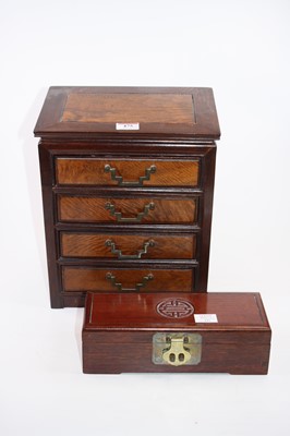 Lot 475 - A Chinese hardwood jewellery chest containing...