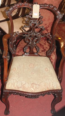 Lot 1379 - An early 20th century floral carved mahogany...