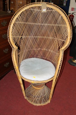 Lot 1408 - A wicker peacock chair (with losses and damages)