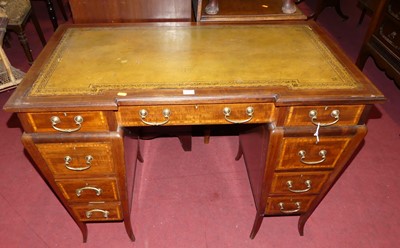 Lot 1413 - A circa 1900 mahogany and gilt tooled green...