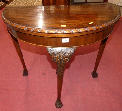 Lot 1466 - A mid 20th century mahogany demi lune...