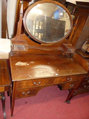 Lot 1480 - An Edwardian mahogany oval swing mirror back...
