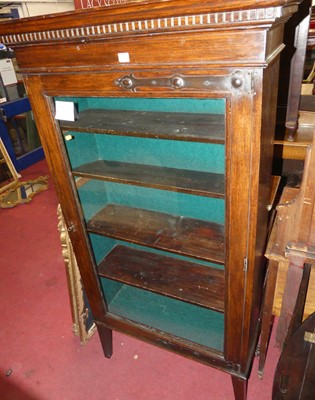 Lot 1486 - An early 20th century oak single door glazed...