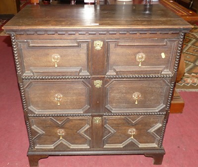 Lot 1435 - An early 20th century geometric and beaded oak...