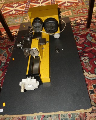 Lot 1444 - A mounted electrically powered lathe