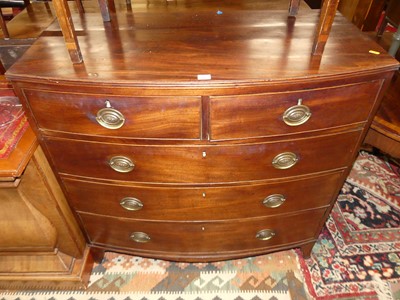Lot 1462 - A Regency mahogany bowfront chest of two short...