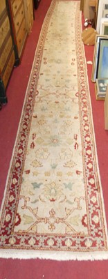 Lot 1196 - A Turkish woollen cream ground long hall...