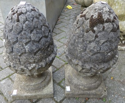 Lot 1504 - A pair of reconstituted stone garden...