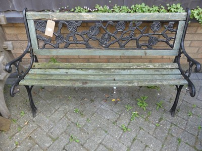 Lot 1508 - A black painted wrought metal and stained wood...