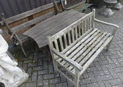 Lot 1509 - A contemporary teak slatted two-seater garden...