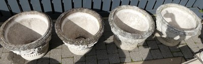 Lot 1516 - A set of four large reconstituted stone...