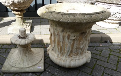 Lot 1517 - A reconstituted stone pedestal garden urn...