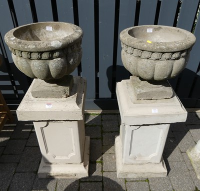 Lot 1523 - A pair of reconstituted stone footed...