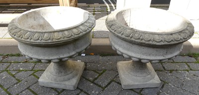 Lot 1524 - A pair of reconstituted stone squat footed...