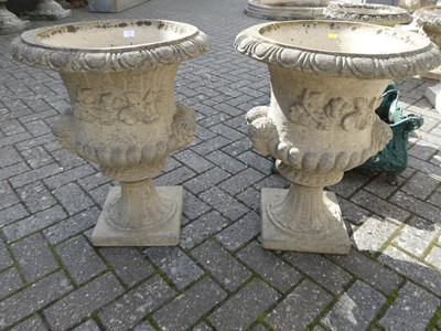 Lot 1530 - A pair of reconstituted stone pedestal garden...