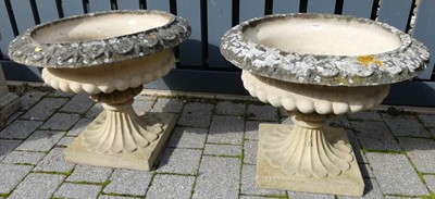 Lot 1536 - A pair of reconstituted stone pedestal...
