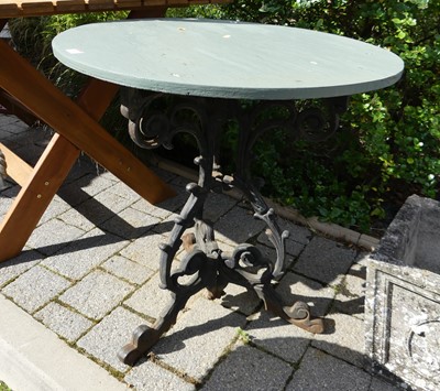 Lot 1543 - A floral decorated wrought iron based garden...