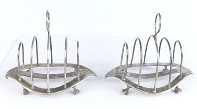 Lot 2096 - A pair of late Victorian silver toast racks,...