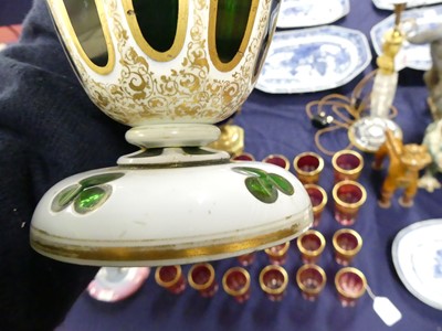 Lot 2055 - A Bohemian green and white overlaid glass vase,...