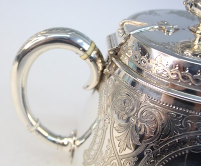 Lot 2092 - A Victorian silver teapot and matching cream,...