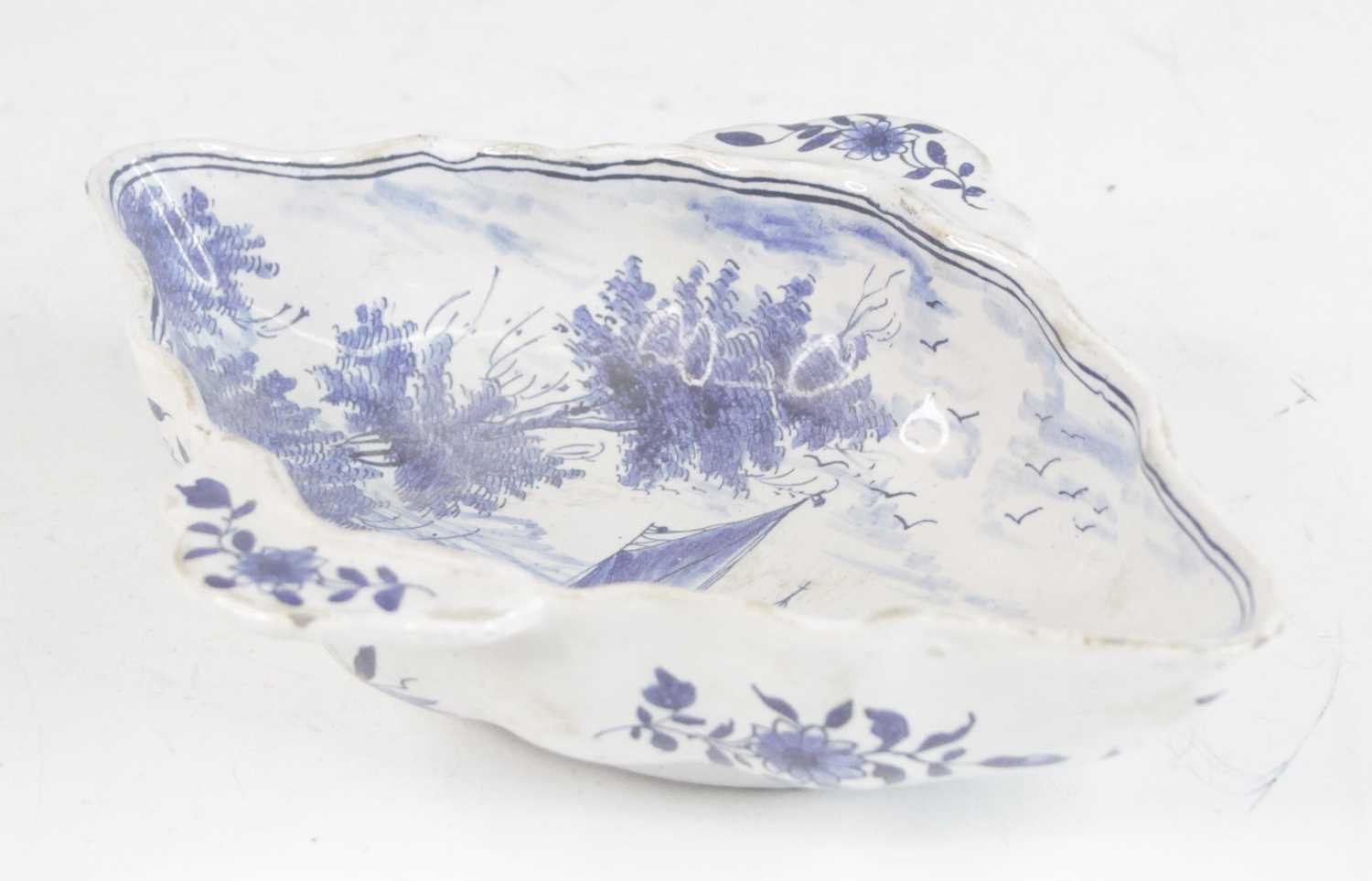 Lot 2029 - A Delft blue and white twin handled sauceboat,...