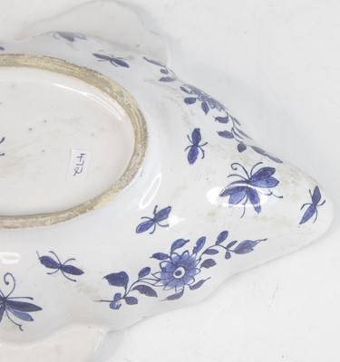 Lot 2029 - A Delft blue and white twin handled sauceboat,...