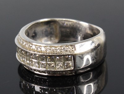 Lot 2680 - A white metal diamond four-row half eternity...