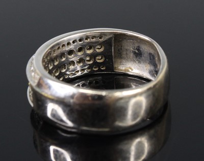 Lot 2680 - A white metal diamond four-row half eternity...
