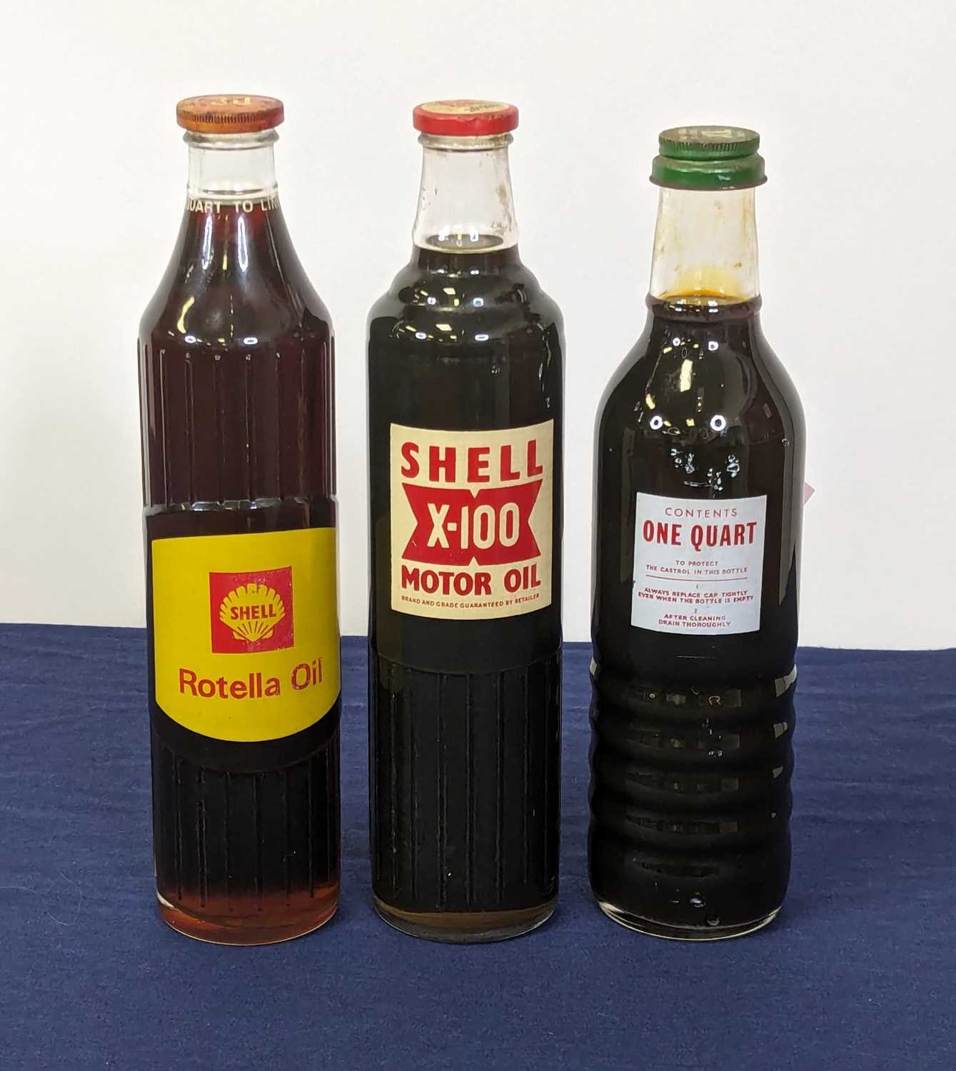 Lot 4034 - A Shell Rotella oil bottle, quart to line (30);...