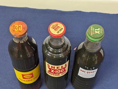 Lot 4034 - A Shell Rotella oil bottle, quart to line (30);...